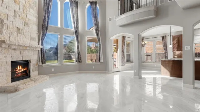 a bathroom with a granite countertop tub sink and double vanity