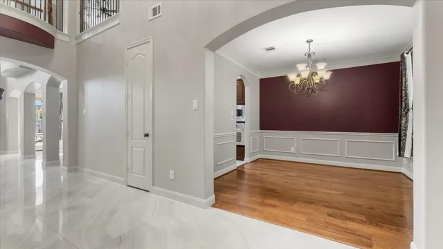 a bathroom with a granite countertop sink a toilet and a large mirror