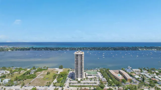 a view of a lake with a city skyline in the background