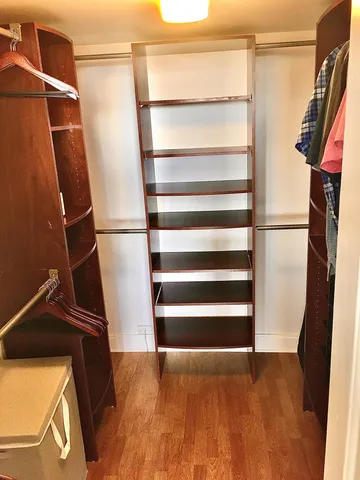 a living room with a couch and a rug