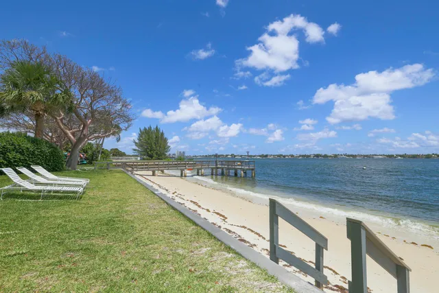 a view of a lake with a city skyline in the background