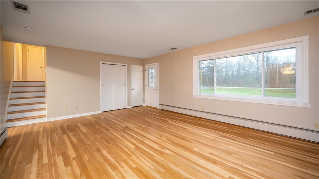 2516 Mercer West Middlesex Road West Middlesex, PA 16159 - Photo 3 of 25 Living room with beautiful original floors and bright newer windows