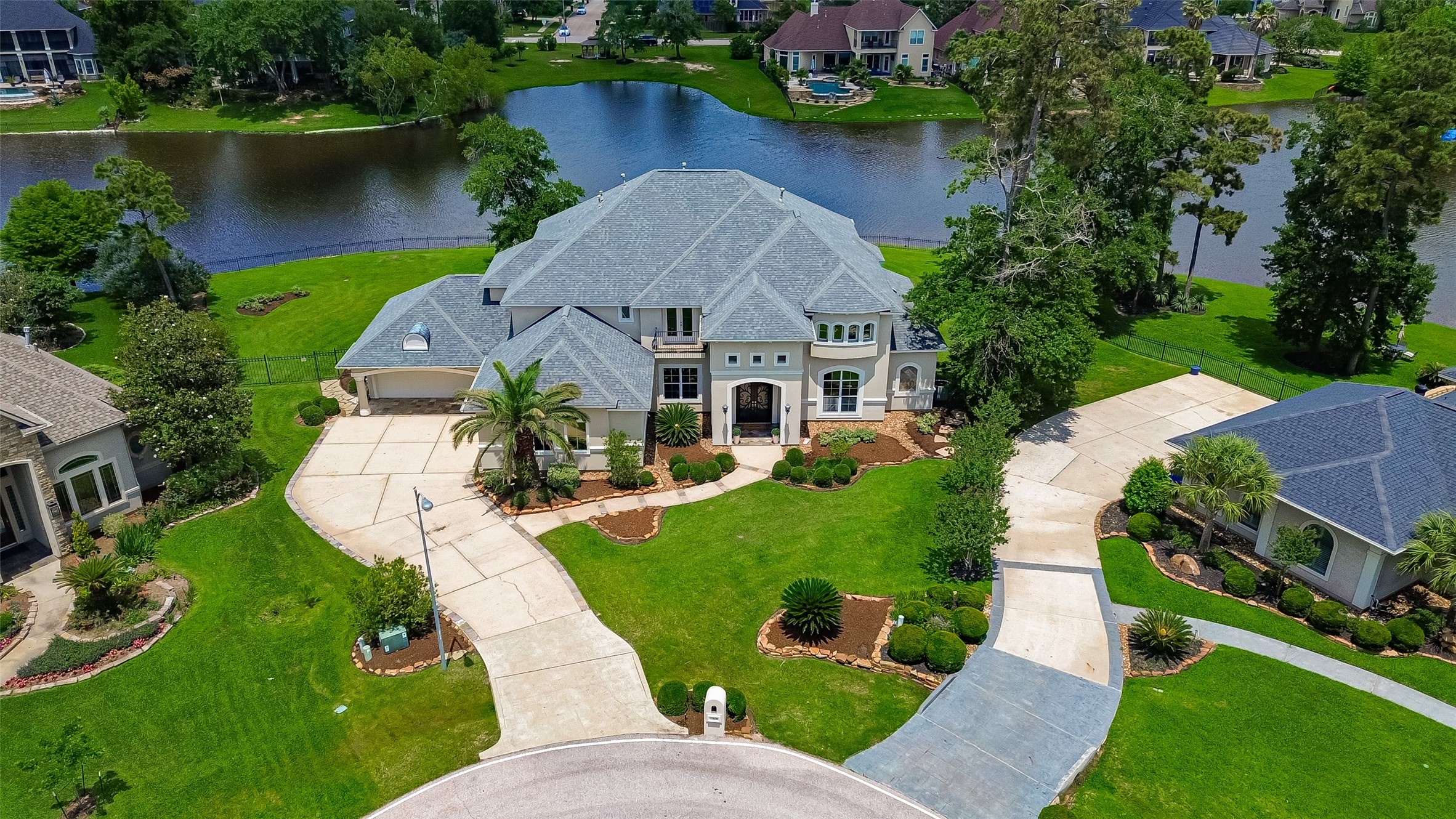 25626 Windy Isle Court Spring, TX 77389 - Photo 1 of 45 Welcome to this amazing home, situated in a serene lakeside setting with lush landscaping and beautiful views of the water and surrounding greenery. Perfect for luxury living.