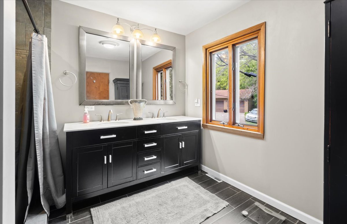 22446 North Old Barrington Road Barrington, IL 60618 - Photo 25 of 49 a bathroom with a sink vanity and a mirror
