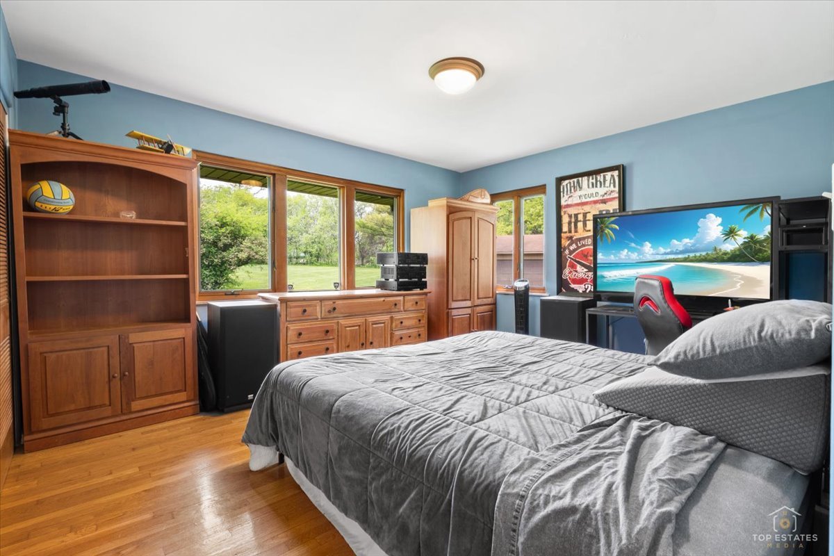 22446 North Old Barrington Road Barrington, IL 60618 - Photo 27 of 49 a bed room with a bed and a television