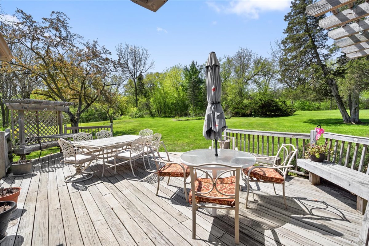22446 North Old Barrington Road Barrington, IL 60618 - Photo 35 of 49 a view of a deck with furniture and a yard