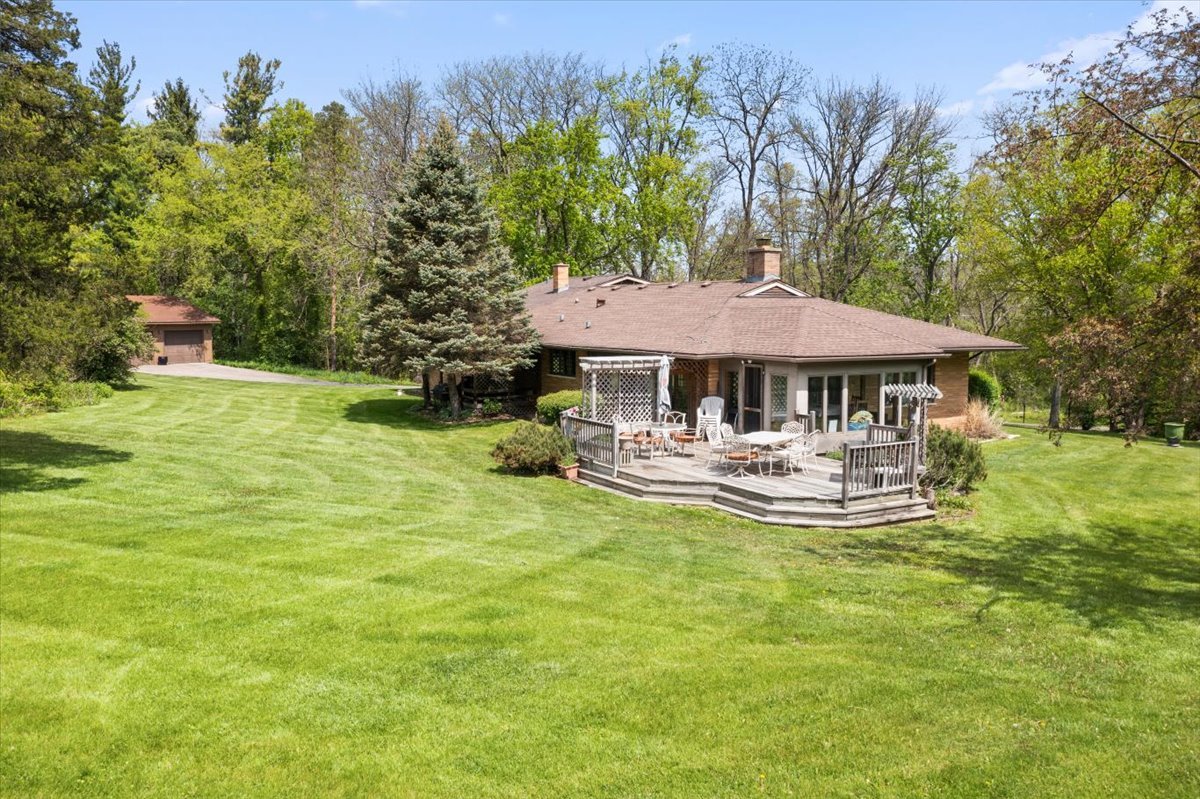 22446 North Old Barrington Road Barrington, IL 60618 - Photo 37 of 49 a front view of a house with swimming pool having outdoor seating