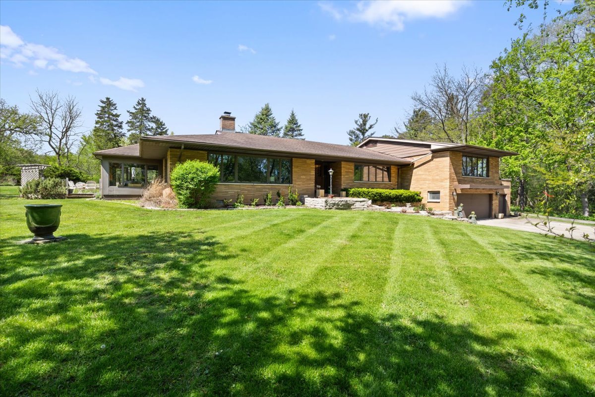 22446 North Old Barrington Road Barrington, IL 60618 - Photo 5 of 49 a view of a house with a yard patio and a garden