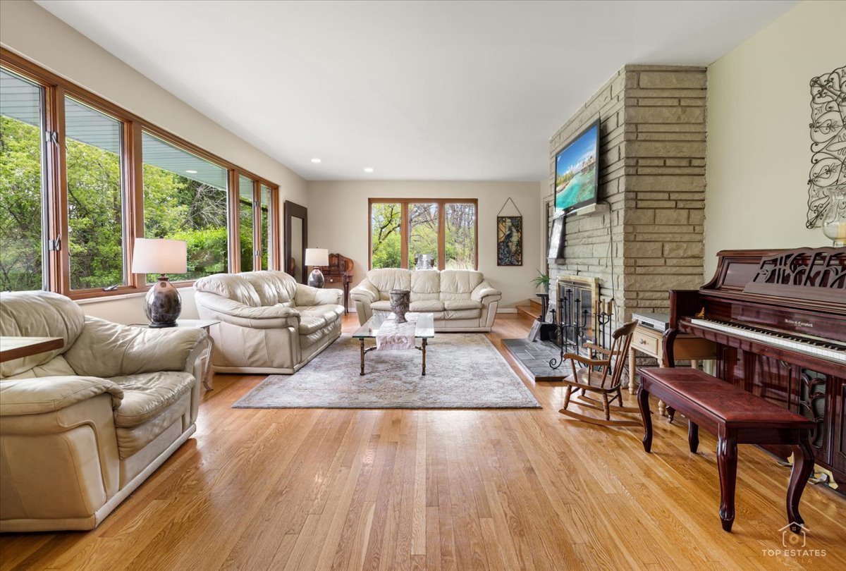 22446 North Old Barrington Road Barrington, IL 60618 - Photo 10 of 49 a living room with furniture floor to ceiling window and wooden floor