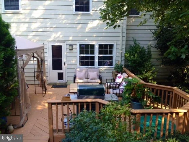 a front view of house with outdoor seating and green space