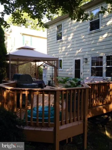 a view of a brick house with a large window