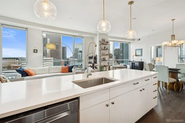 a kitchen with stainless steel appliances a counter space cabinets and furniture