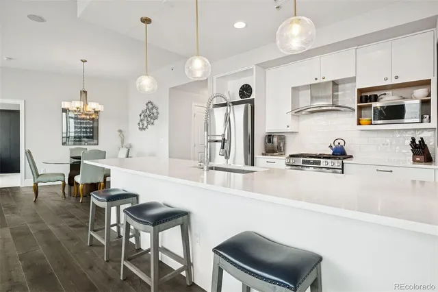a spacious bathroom with a double vanity sink a mirror and a bathtub