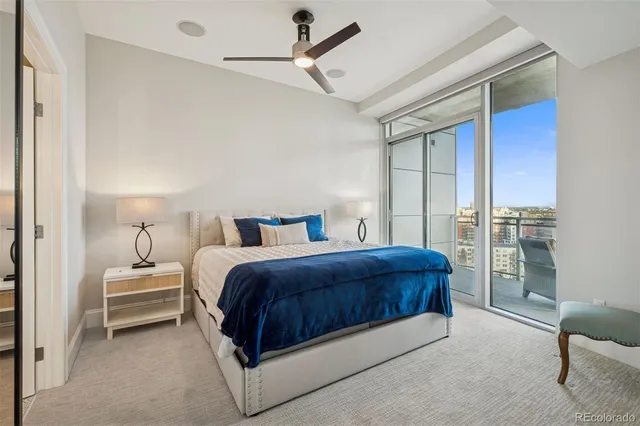 a bedroom with a bed and a television