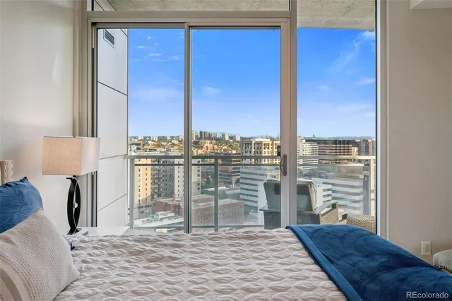 a bathroom with a double vanity sink a mirror and a toilet