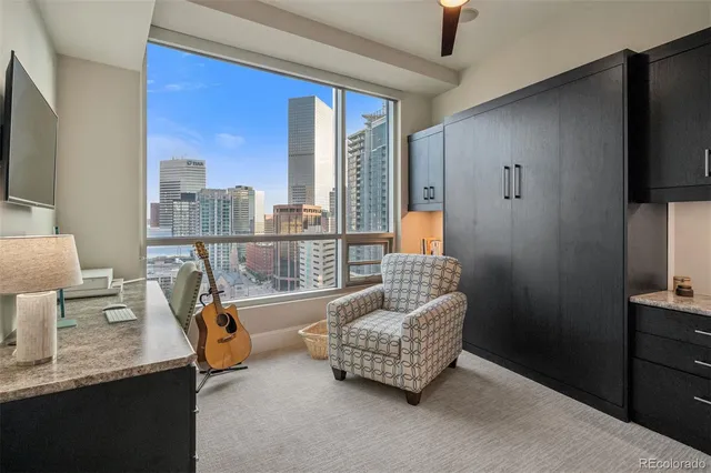 a balcony view with a couch and chandelier