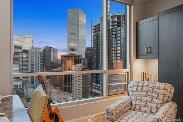 a bedroom with furniture and a flat screen tv