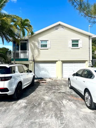 a view of a car in front of a house