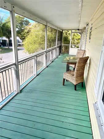 a view of a bench in backyard of the house