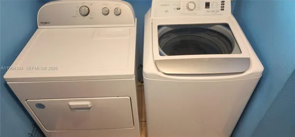 a utility room with dryer and washer