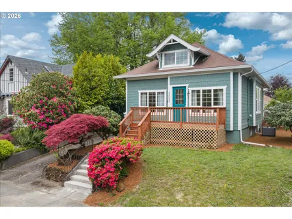a front view of a house with a garden