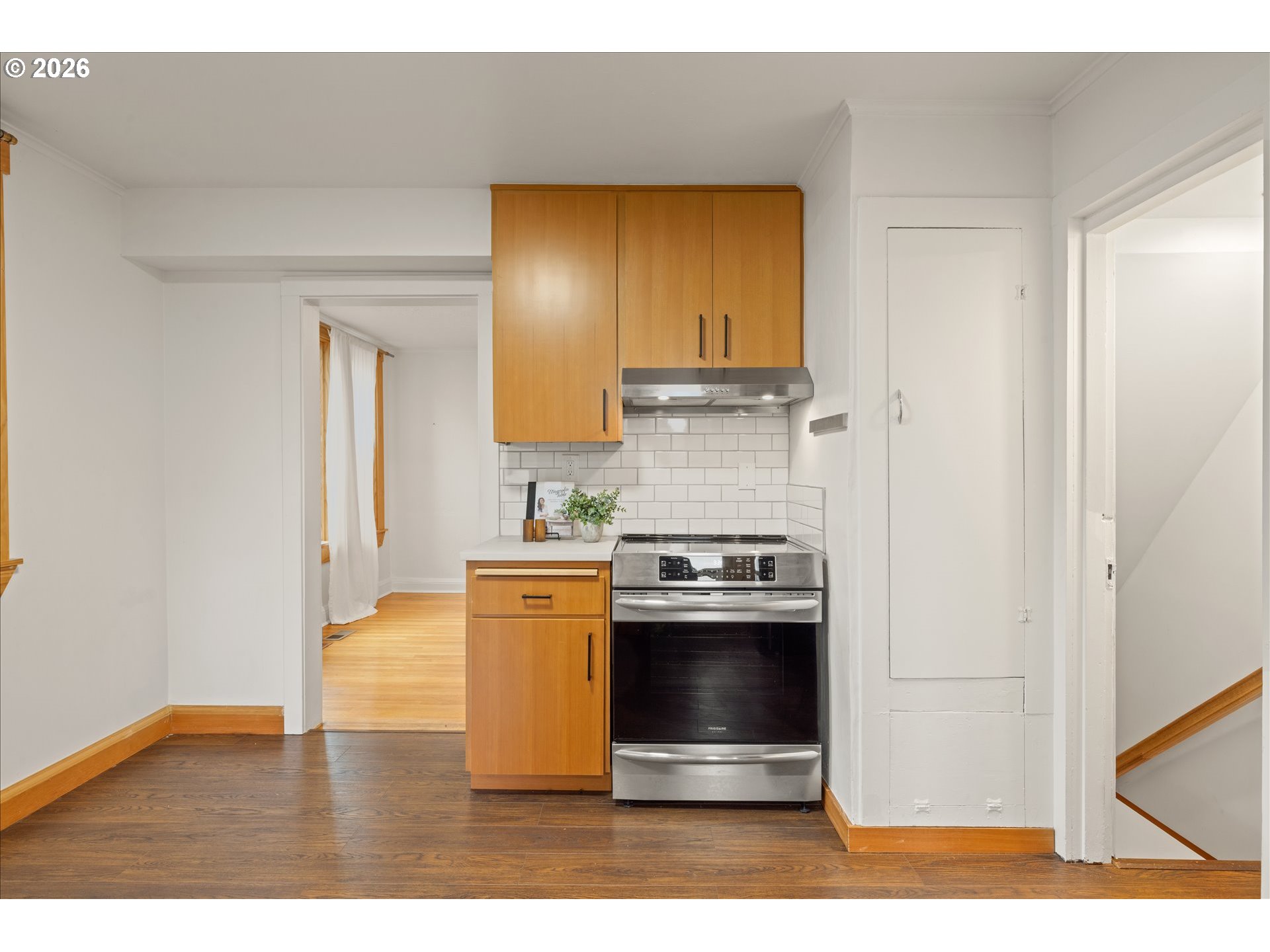 2055 North Alberta Street Portland, OR 97217 - Photo 11 of 38 a kitchen with stainless steel appliances granite countertop a refrigerator a stove and a sink
