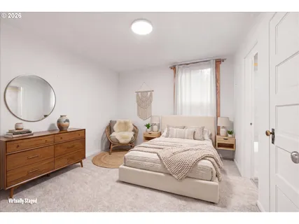 a bedroom with a bed and a dresser