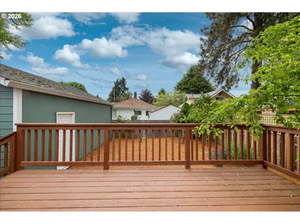 a view of balcony with wooden floor