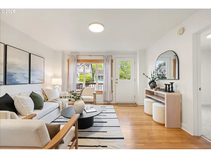 a living room with furniture and a large window