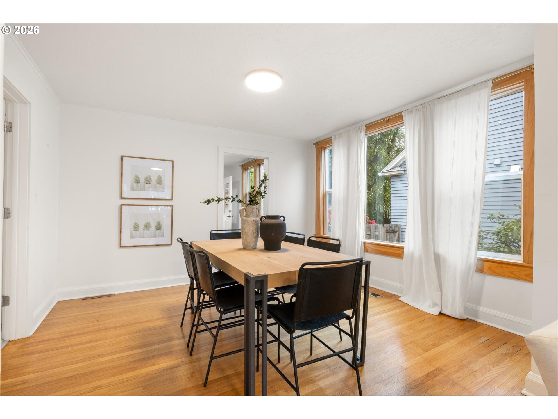 2055 North Alberta Street Portland, OR 97217 - Photo 6 of 38 a view of a dining room with furniture and wooden floor