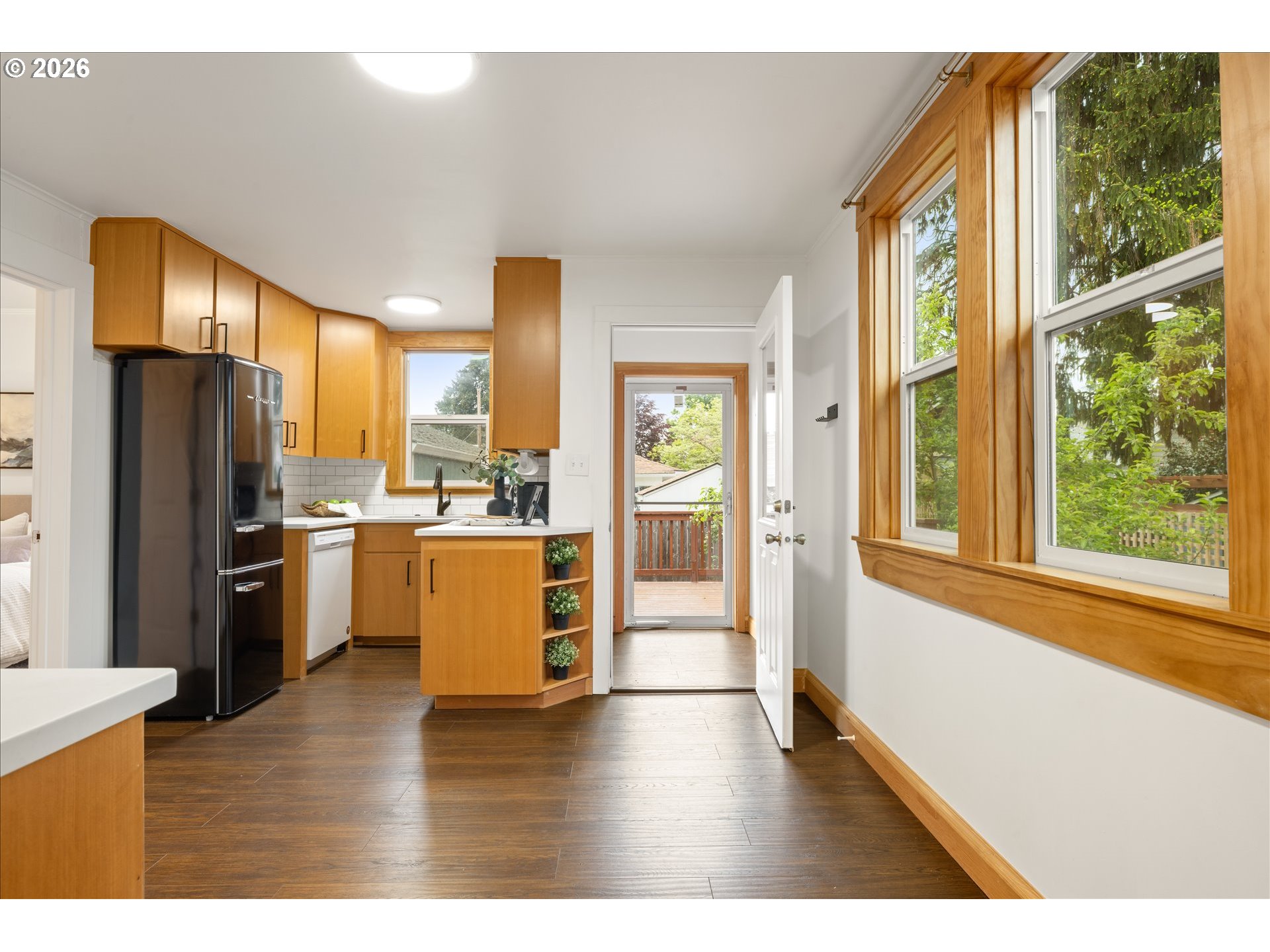 2055 North Alberta Street Portland, OR 97217 - Photo 8 of 38 a kitchen with a refrigerator and a sink