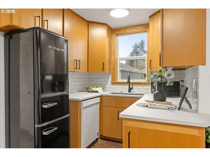 a kitchen with a sink and cabinets