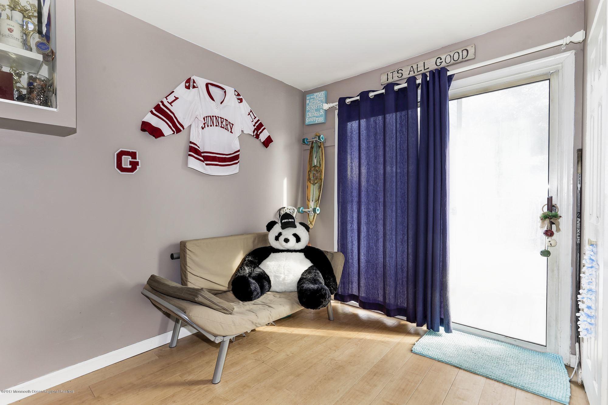 27 Long Road Freehold, NJ 07728 - Photo 15 of 25 a room with a table and a chair