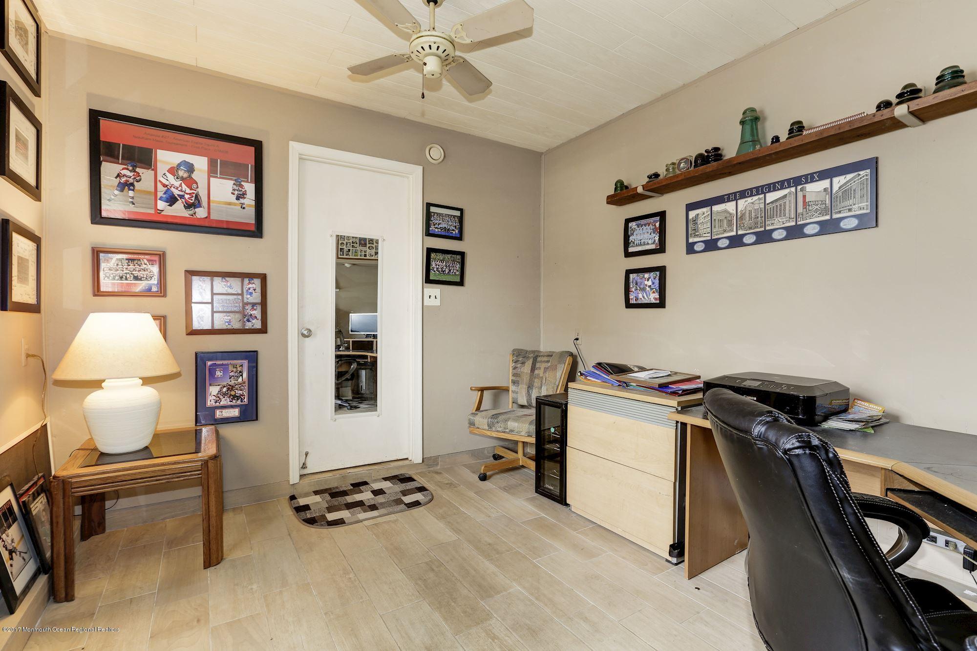 27 Long Road Freehold, NJ 07728 - Photo 18 of 25 a bedroom with furniture and a chair