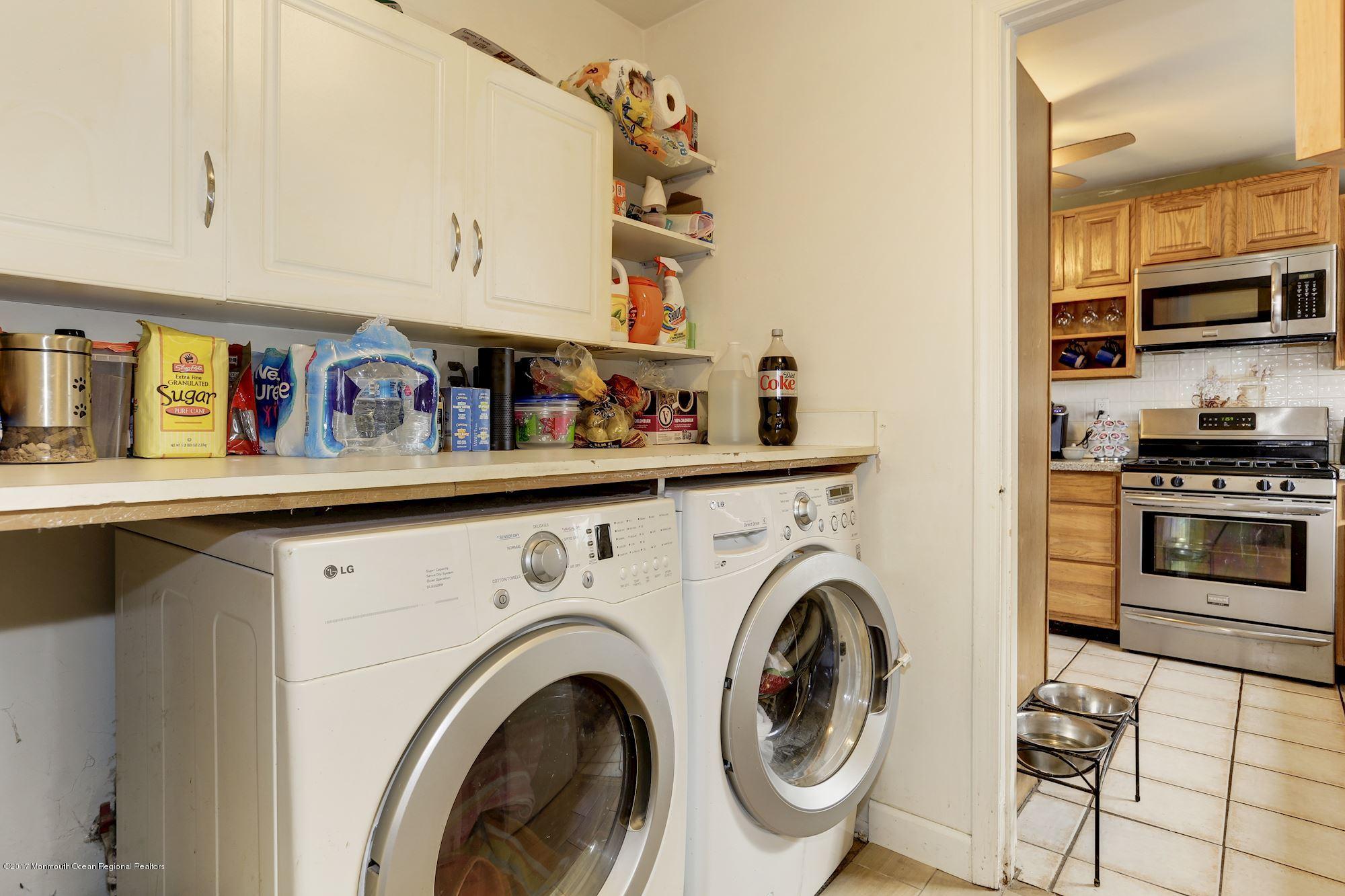27 Long Road Freehold, NJ 07728 - Photo 21 of 25 a view of kitchen with washer and dryer