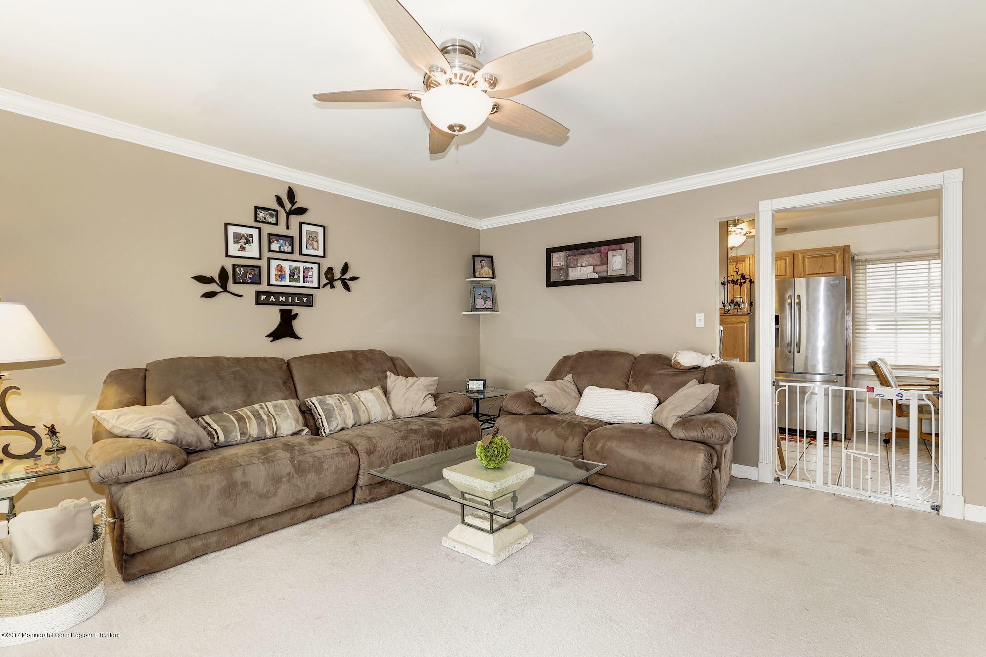 27 Long Road Freehold, NJ 07728 - Photo 3 of 25 a living room with furniture and a large window
