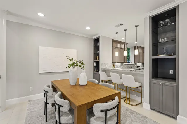 a dining room with furniture and window