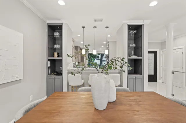 a close view of dining table chairs and entryway