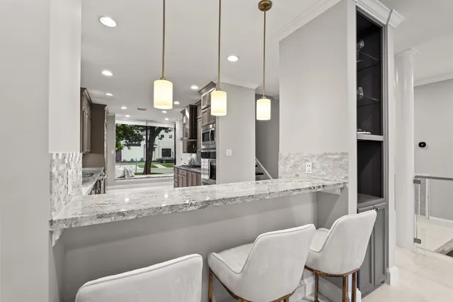 a kitchen with a table and chairs
