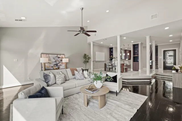 a living room with furniture and white walls