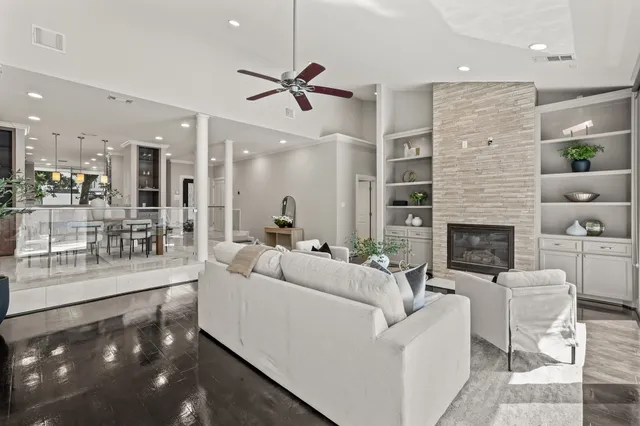 a living room with furniture and a fireplace