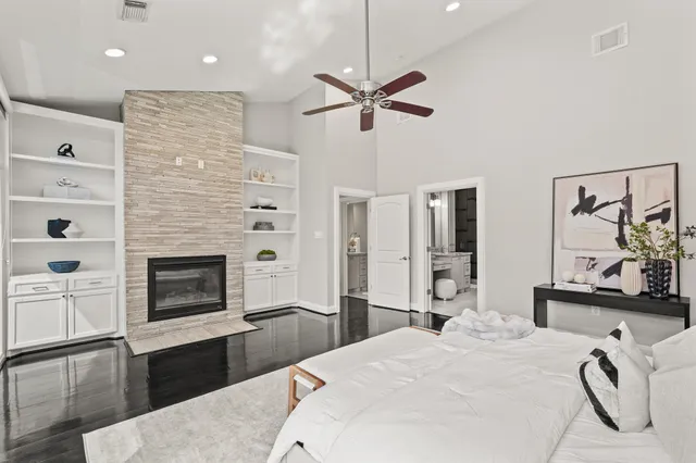 a bedroom with a bed and a fireplace