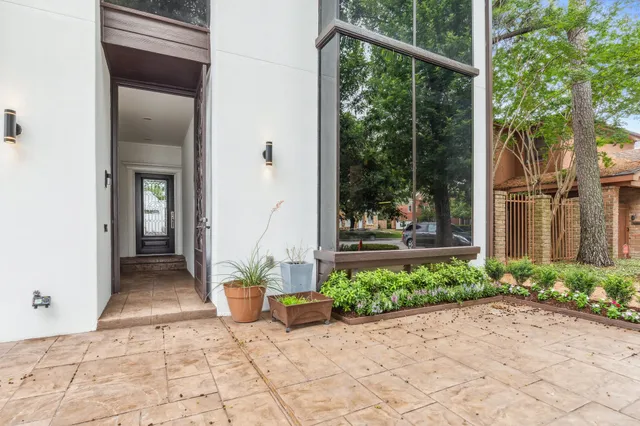 a view of a entrance door of house with yard