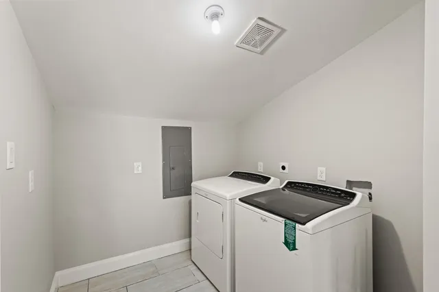 a utility room with dryer and washer