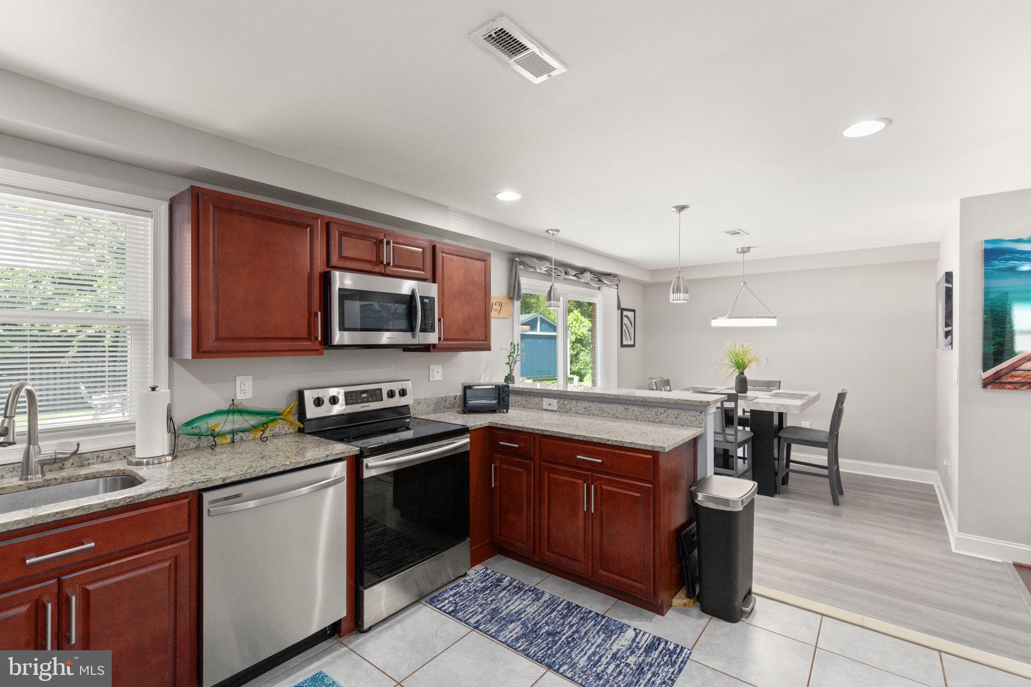 814 Foxwell Road Joppa, MD 21085 - Photo 6 of 21 a kitchen with a sink stove and microwave