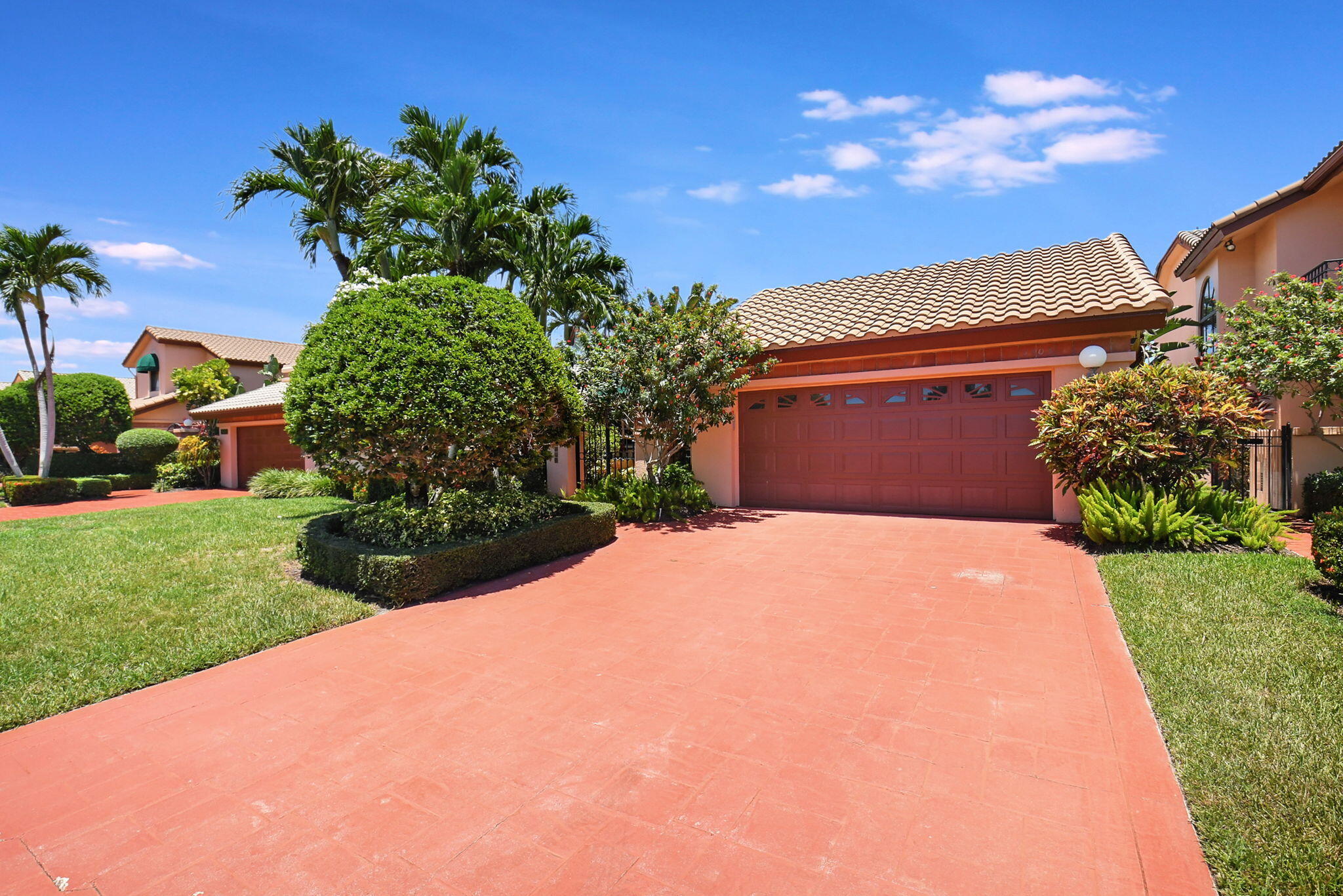 6403 Via Rosa Boca Raton, FL 33433 - Photo 4 of 46 a front view of a house with a yard
