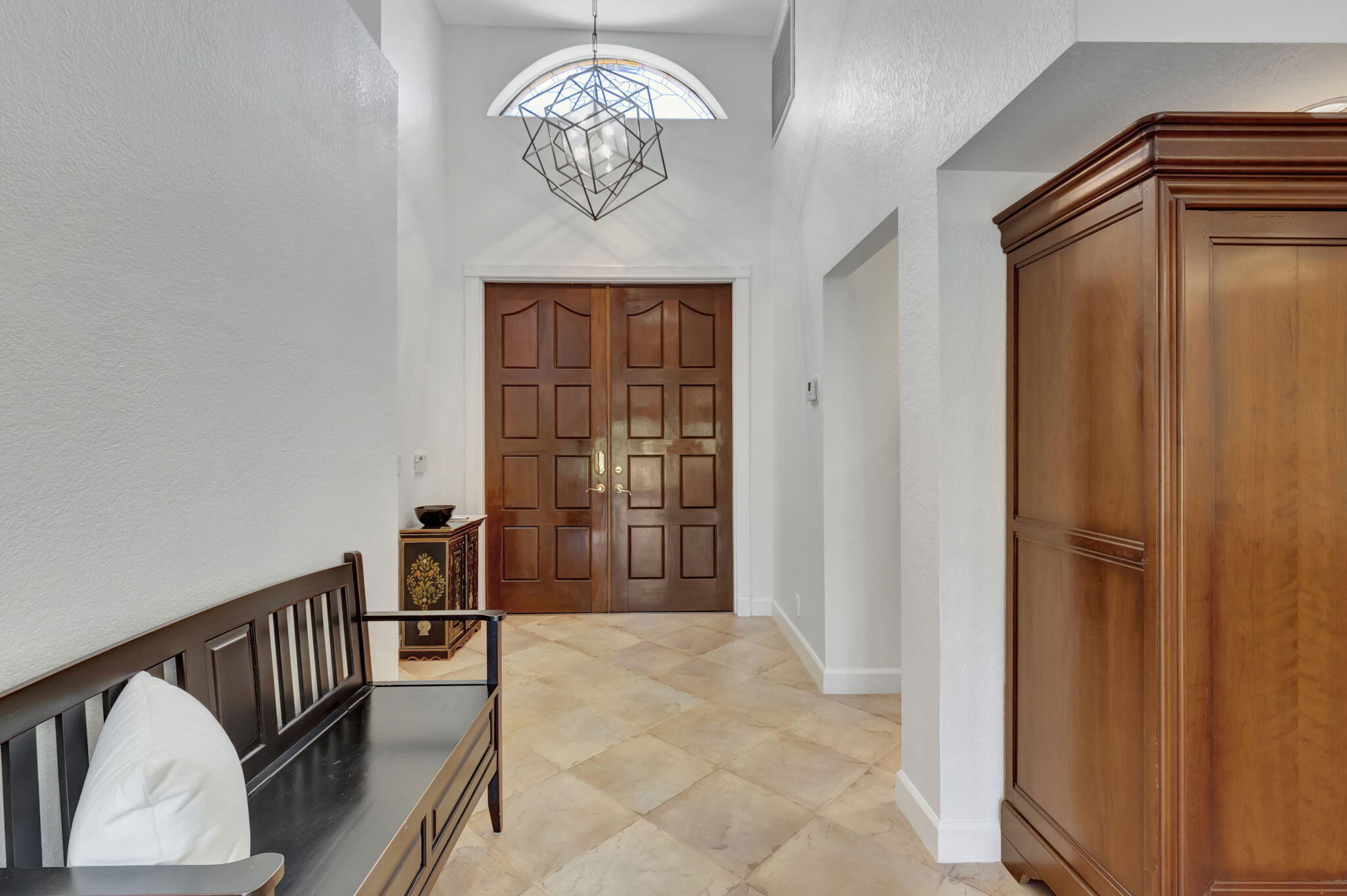 6403 Via Rosa Boca Raton, FL 33433 - Photo 8 of 46 a view of a hallway with a chandelier