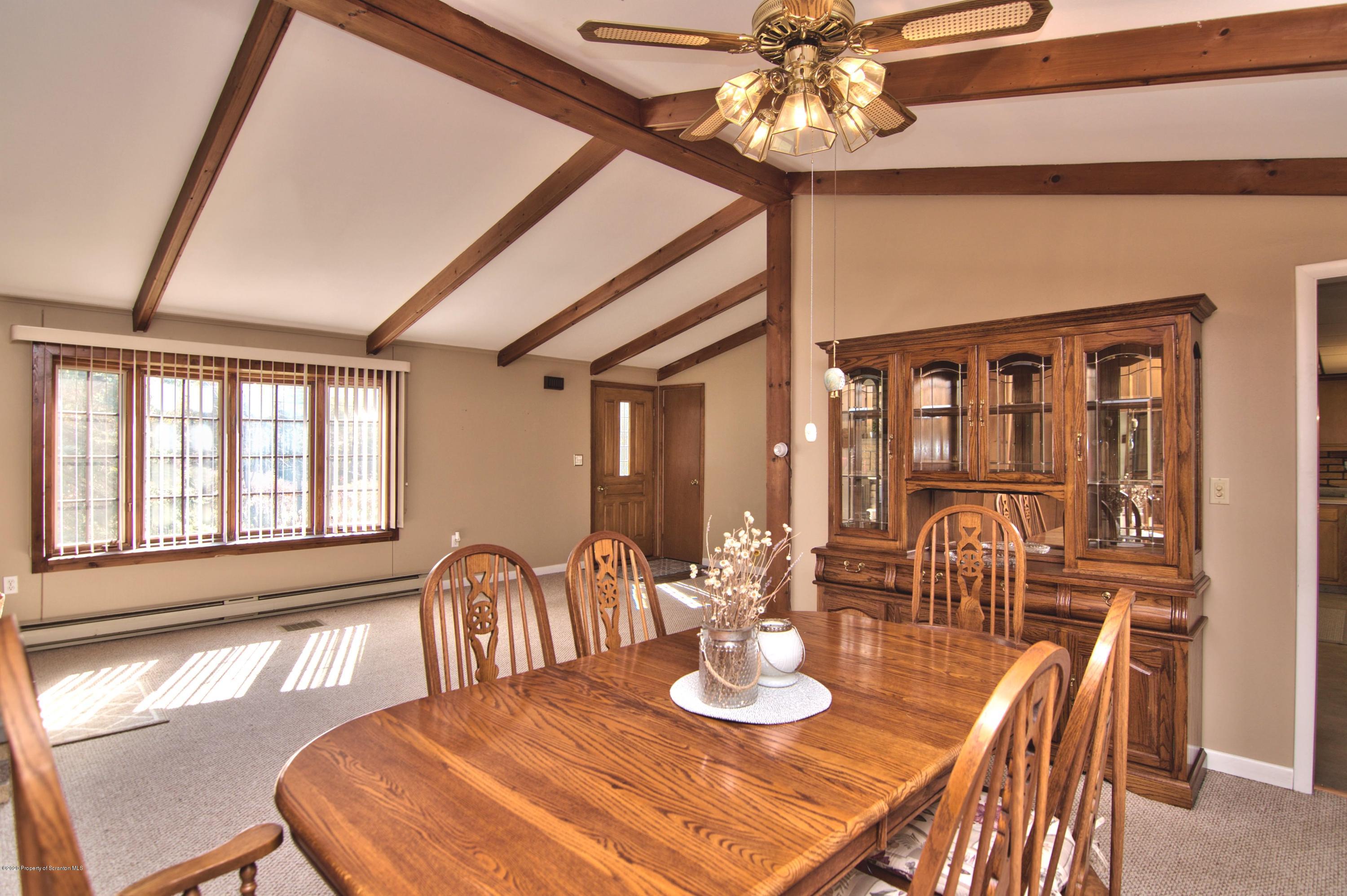 2151 Aberdeen Road Moscow, PA 18444 - Photo 15 of 65 a view of a dining room with furniture and chandelier