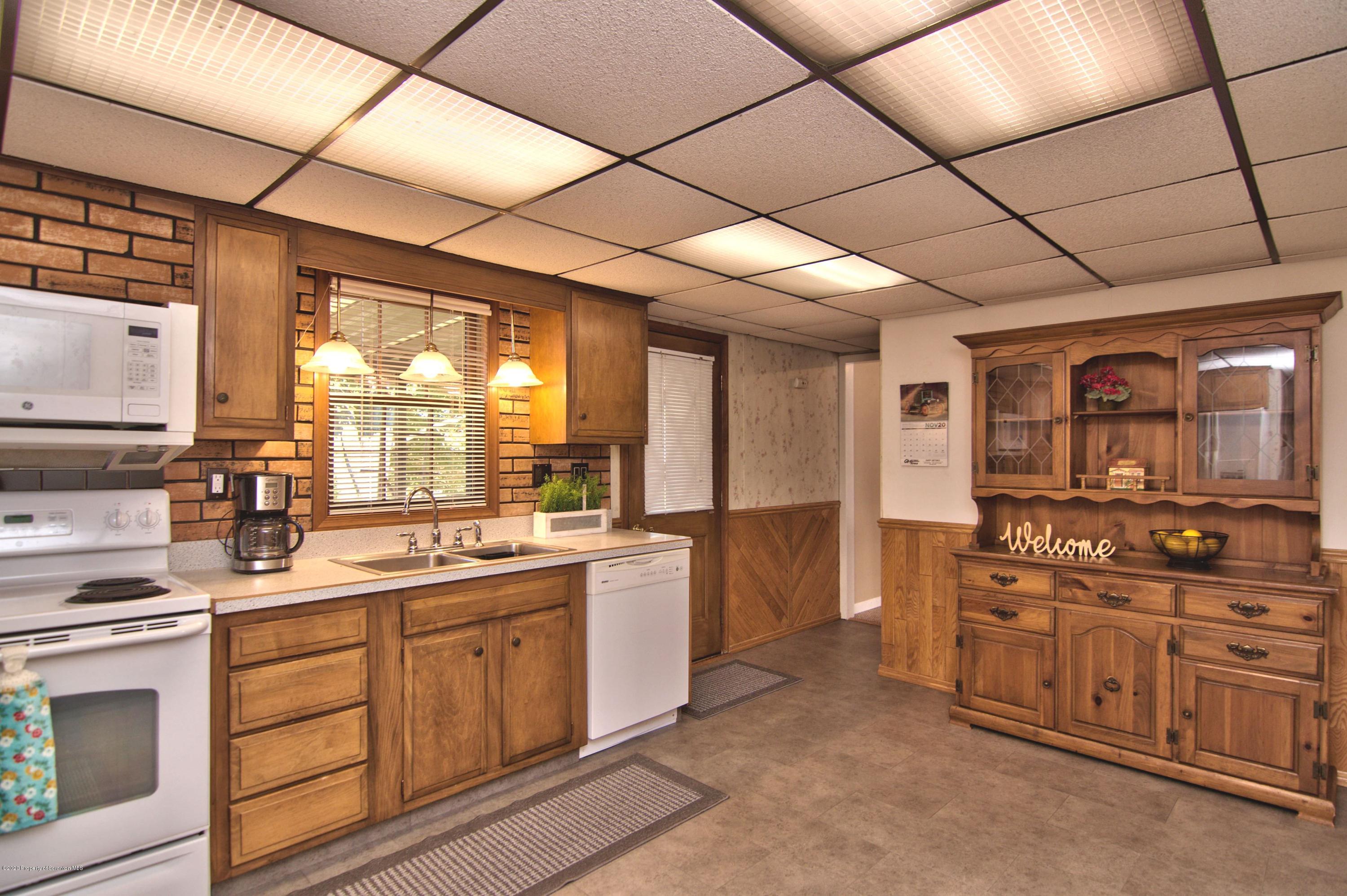2151 Aberdeen Road Moscow, PA 18444 - Photo 19 of 65 a kitchen with a sink stove and cabinets