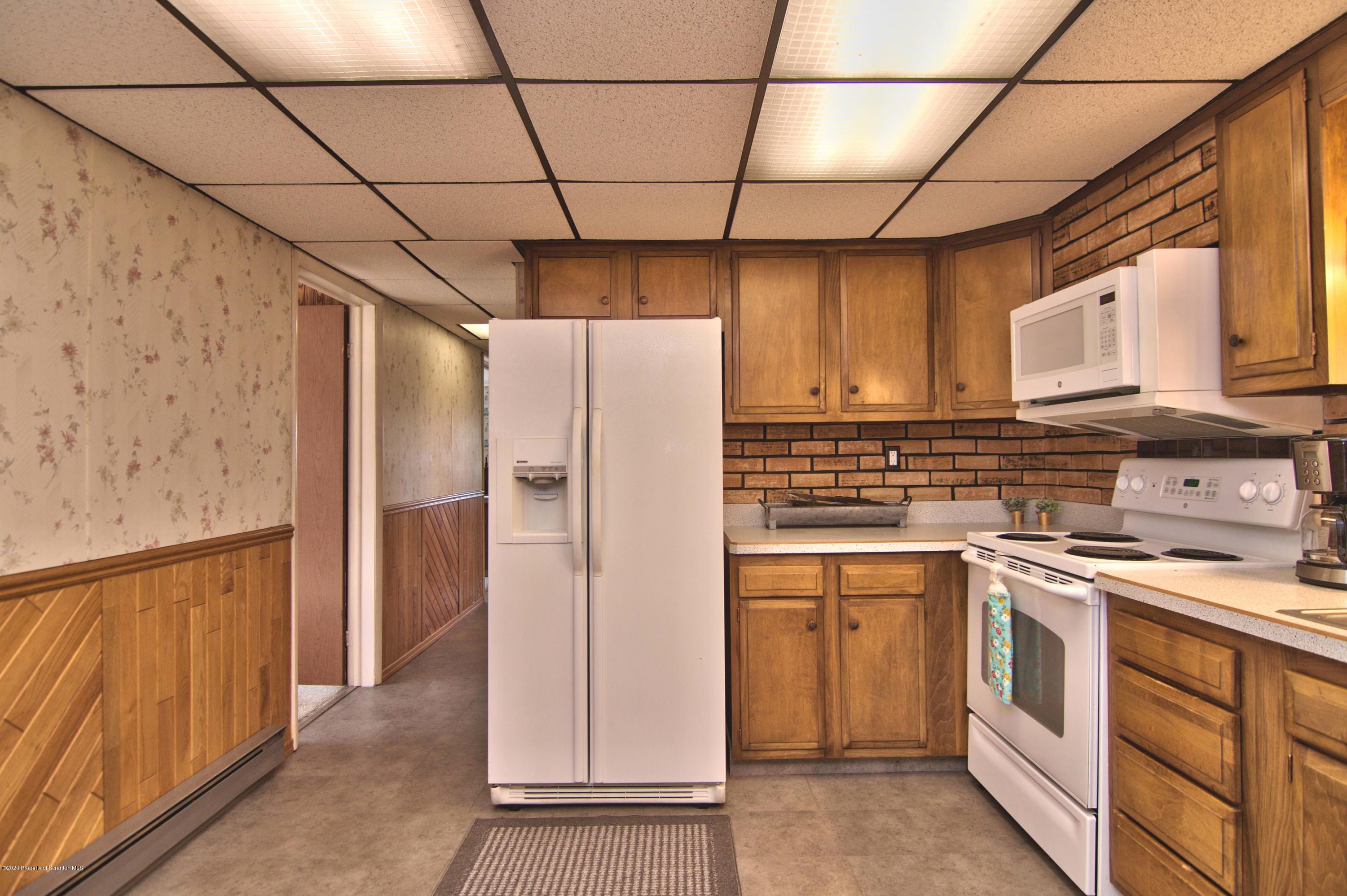 2151 Aberdeen Road Moscow, PA 18444 - Photo 22 of 65 a kitchen with stainless steel appliances a refrigerator and a stove